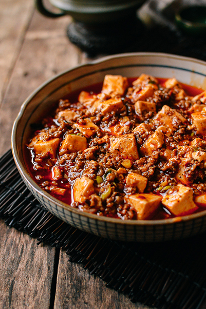 Spicy bowl of mapo tofu, a traditional Chinese dish with tofu, ground pork or beef, and Sichuan peppercorn