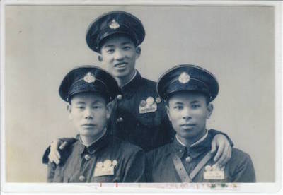A vintage photo from 1951 of three Chinese soldiers