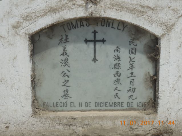Chinese tombstone with English, Chinese and Spanish text engraved