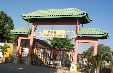 A sign on a Chinese gateway outside the Chinese Cemetery in Kingston, Jamaica reads ‘Chinese Cemetery’ 