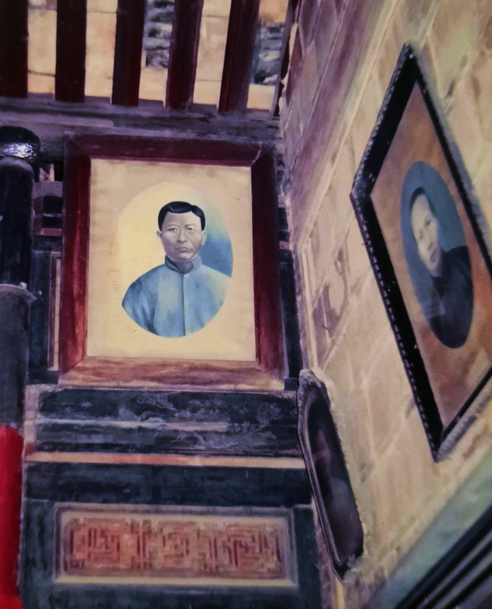 Painted portrait of a Chinese ancestor hanging in an ancestral temple